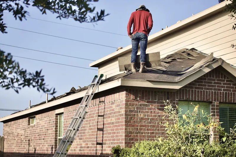 Professional roofer working on a residential roof in Sierra Lakes